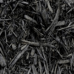 Close-up view of dark mulch, composed of shredded bark and wood pieces, creating a textured appearance suitable for gardening or landscaping uses.