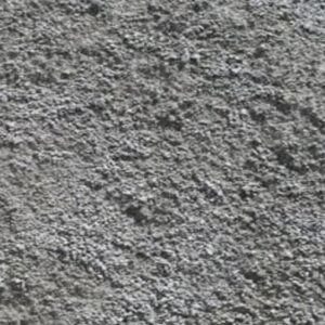 The image shows a close-up of a textured concrete surface, displaying rough, granular patterns with varied shades of gray. No landmarks or buildings.