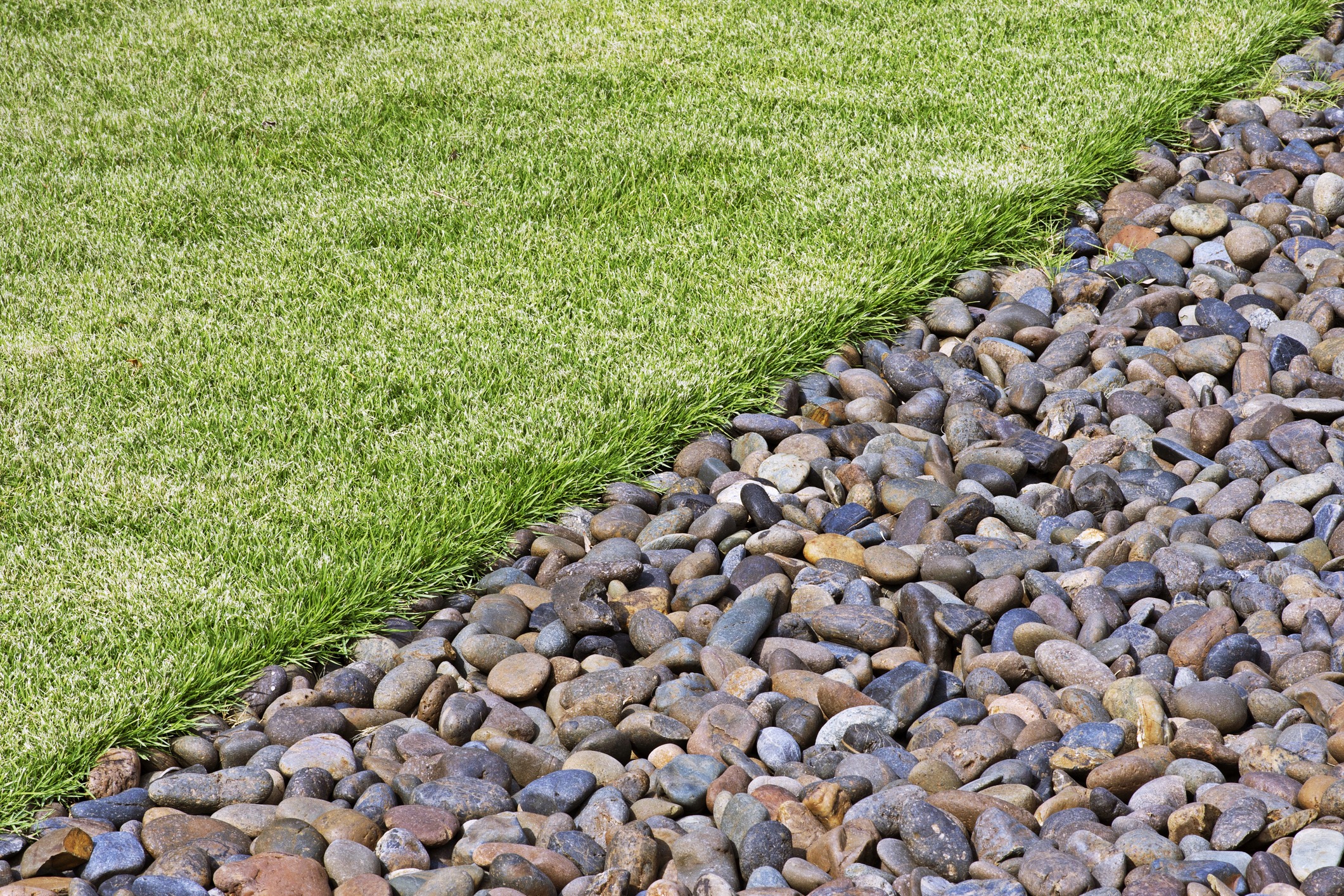 Landscaping rocks and green grass